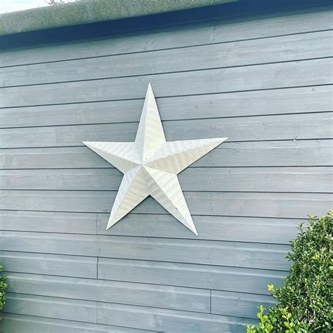 why do people put metal stars on their houses|metal stars on houses.